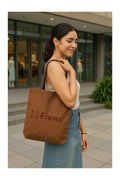 A large, sturdy tote bag with a simple design and comfortable shoulder straps.