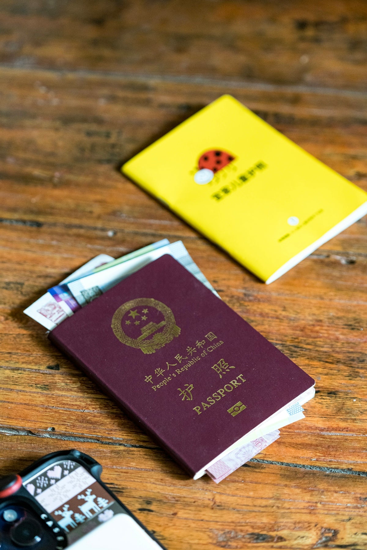 Passport and money on a wooden surface