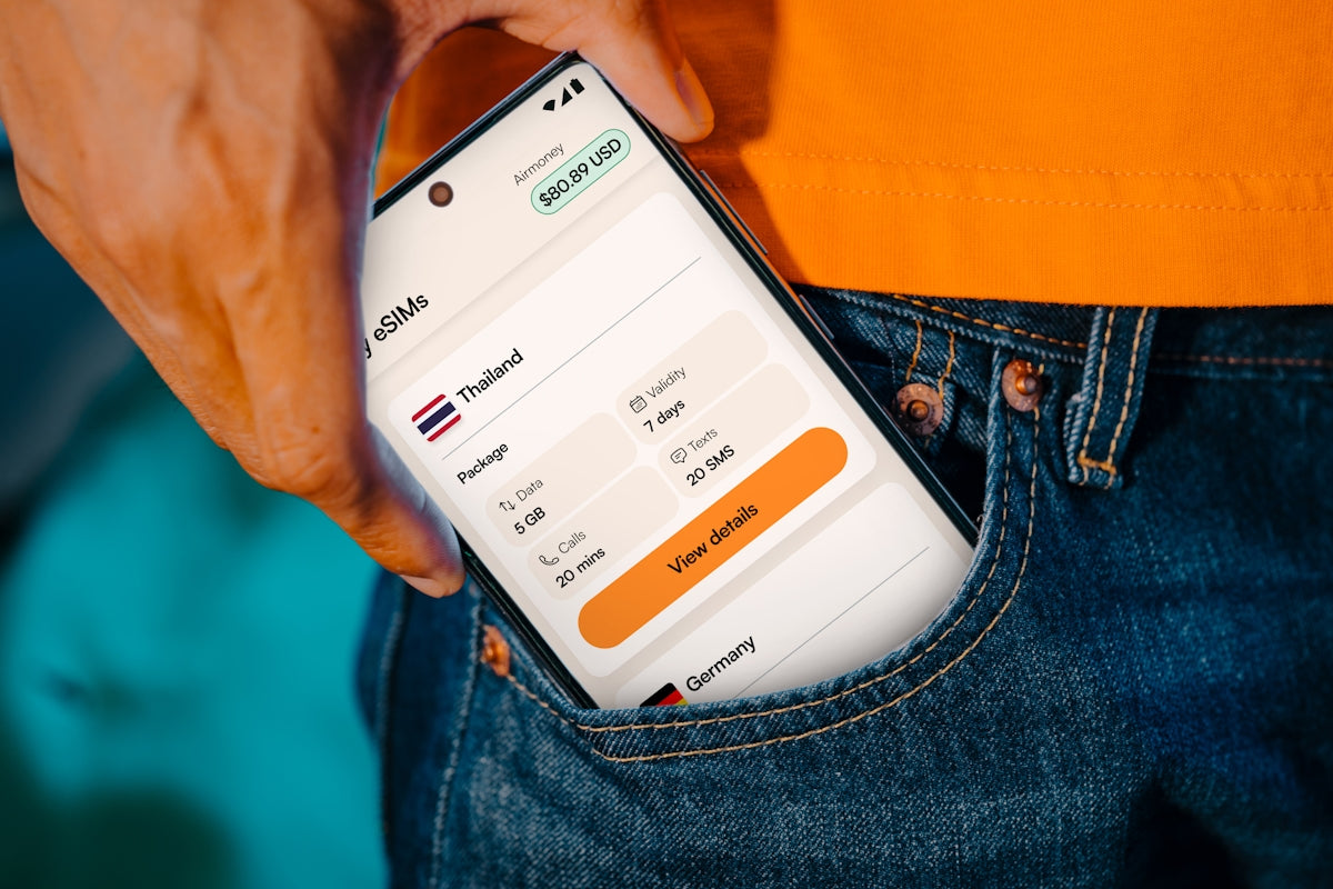 Smartphone displaying travel information in a pocket.