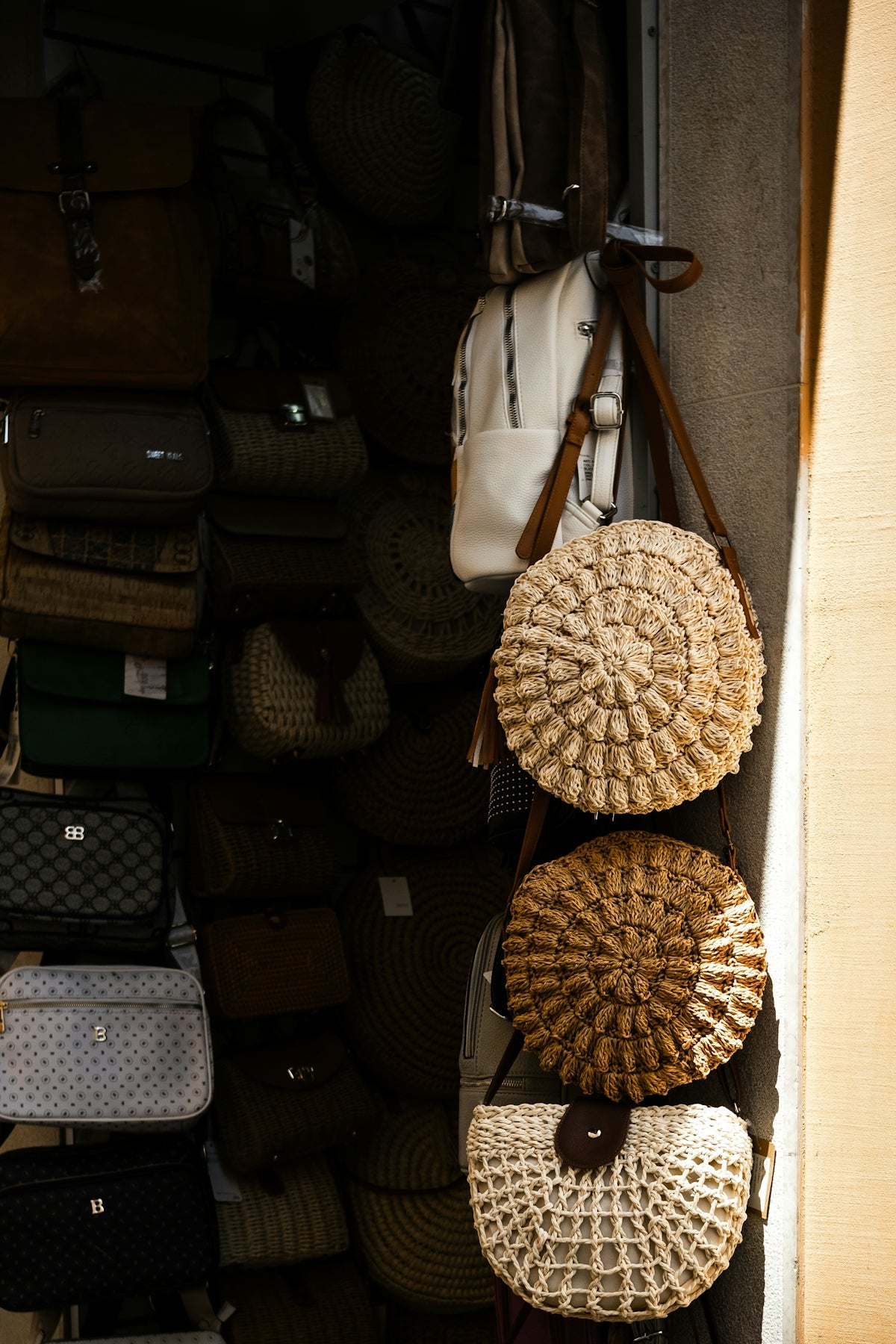 Various bags displayed in a shop window.