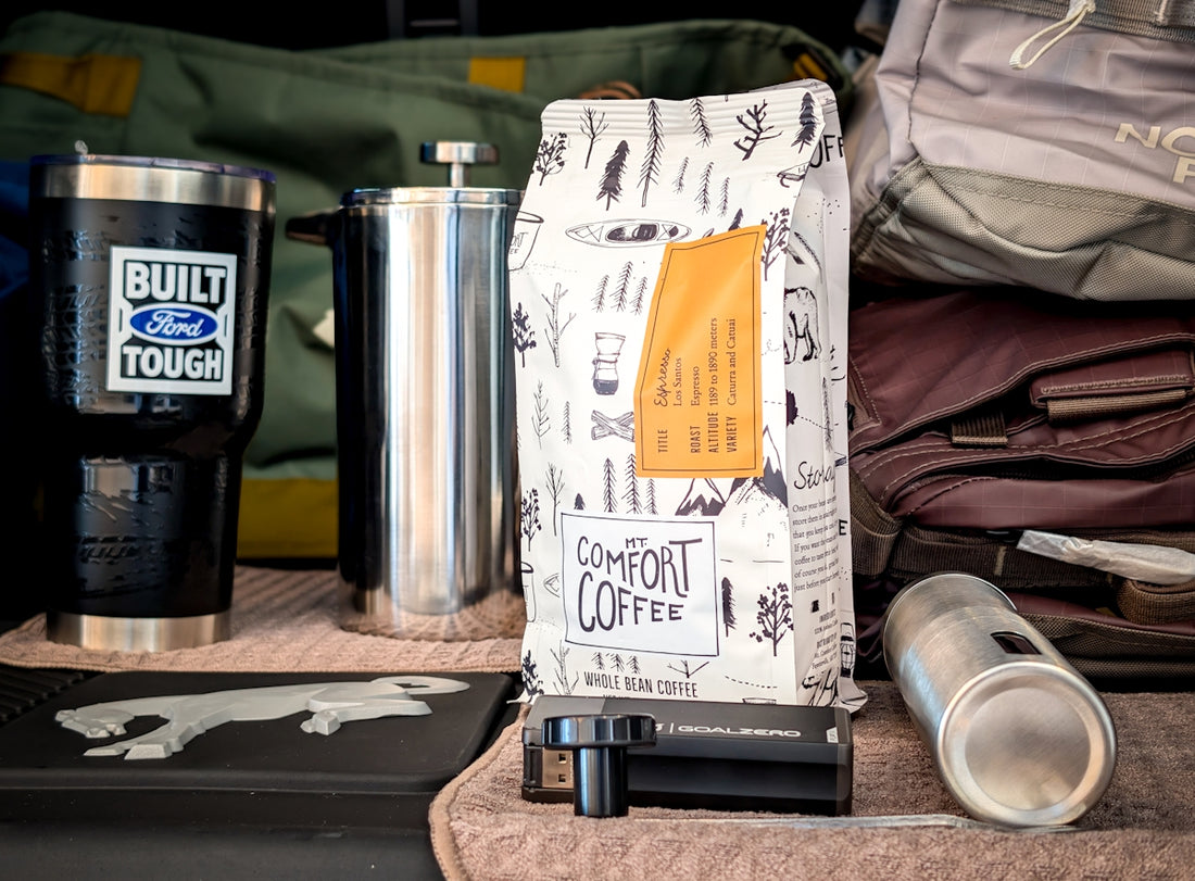 Bag of comfort coffee next to a travel mug.