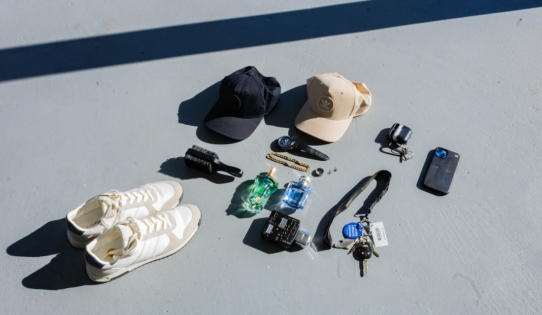 Collection of items including shoes, hats, keys, and phone.