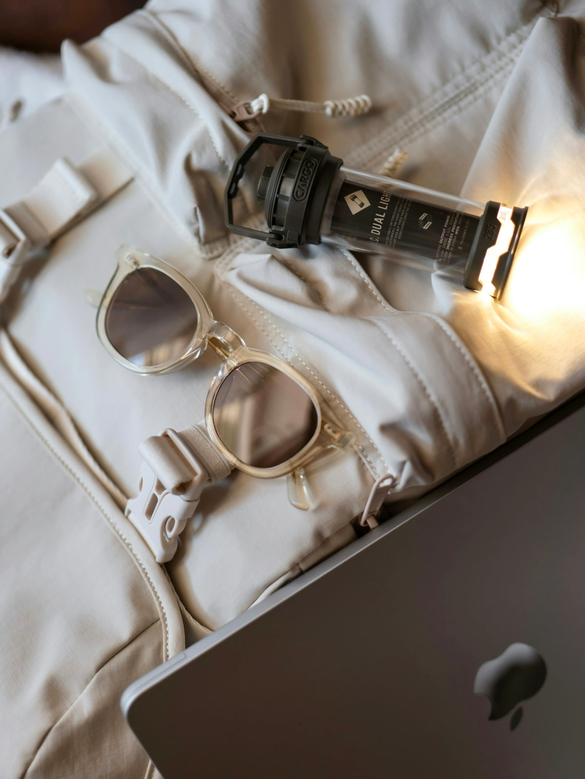 Sunglasses and flashlight on a jacket
